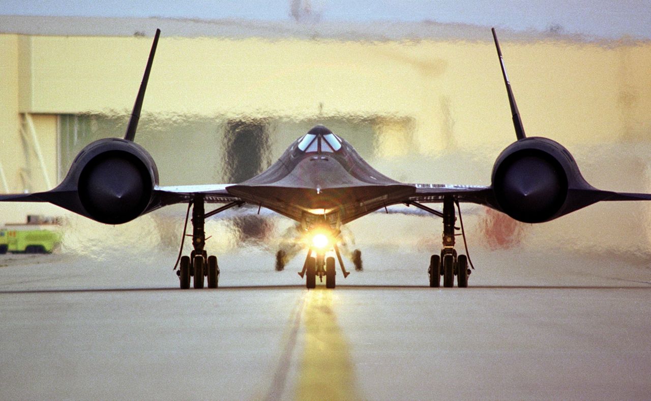  SR-71 Blackbird on the Runway, with heat waves in the background from the engine exhaust. (Source: Lockheed Martin)
